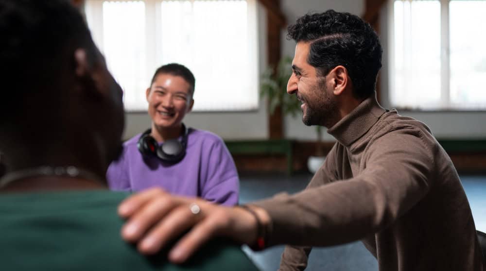 People connecting in a supportive therapeutic environment that complements individual therapy in Massachusetts at Brook Behavioral Health.