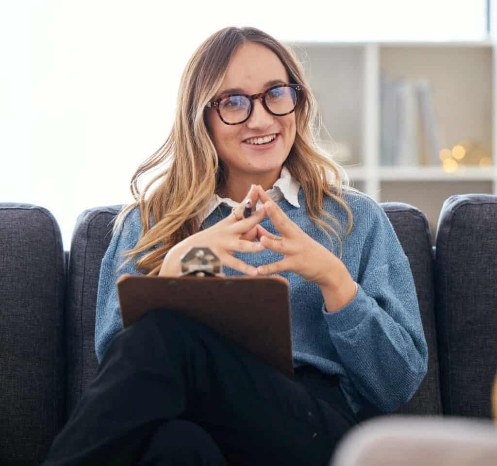 Smiling therapist providing support during DBT in Massachusetts.
