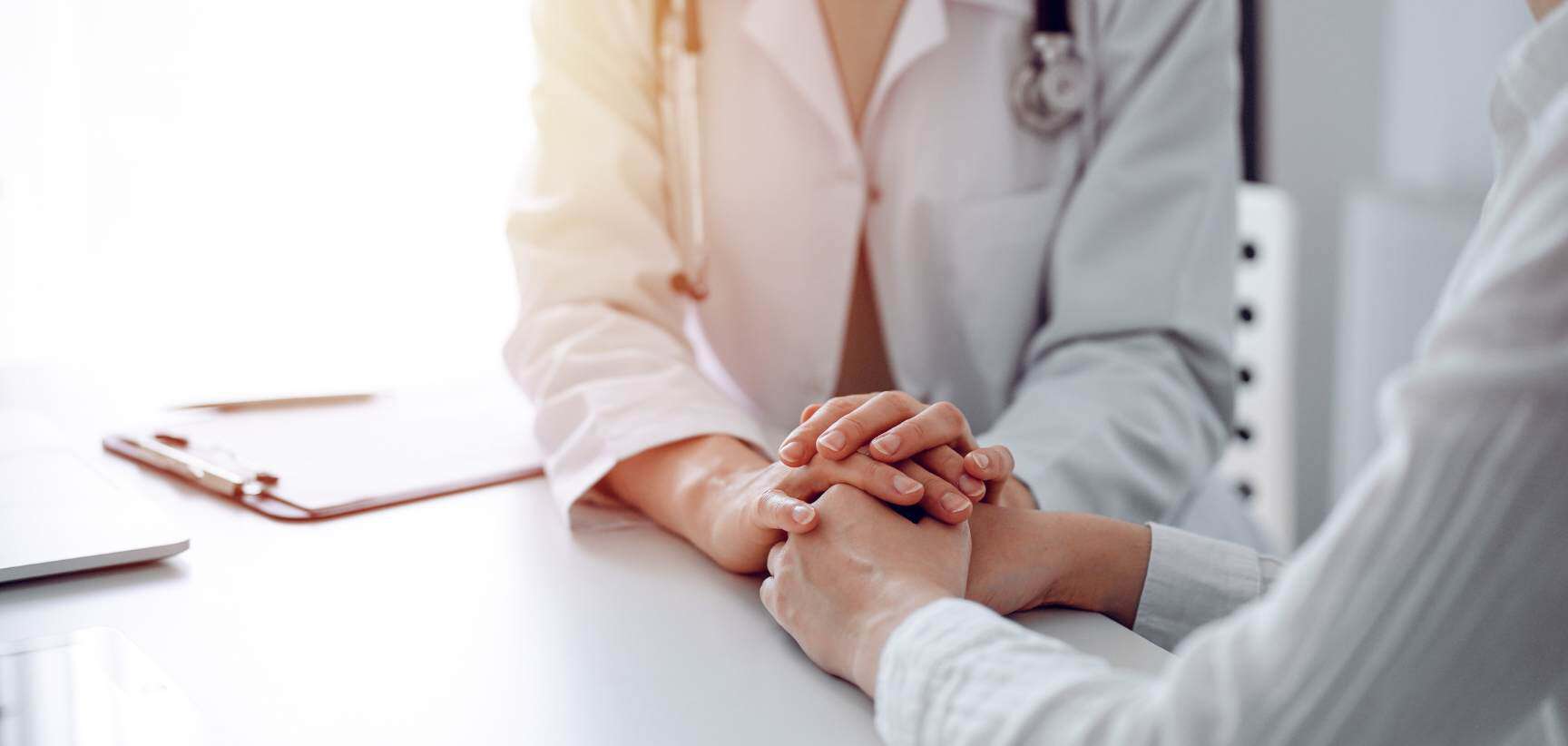 Doctor offering encouragement during medication management in Massachusetts.