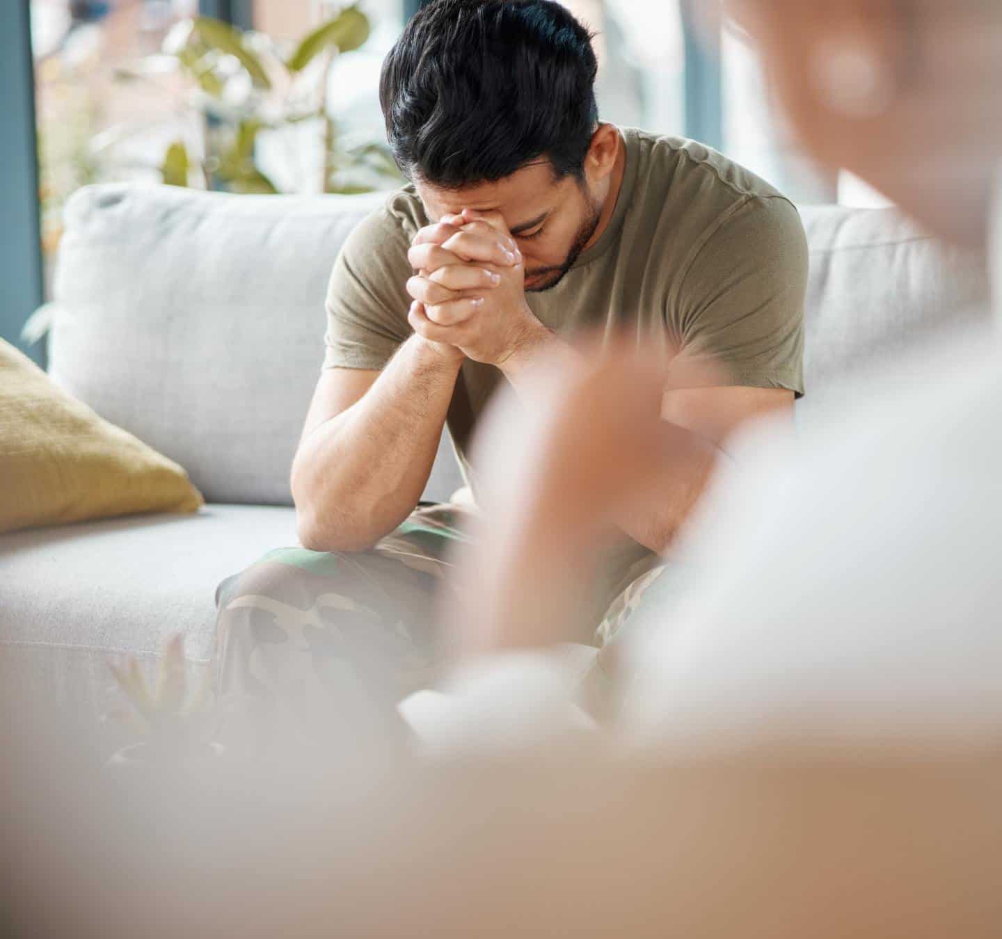 Man processing emotions during individual therapy in PTSD treatment in Massachusetts.