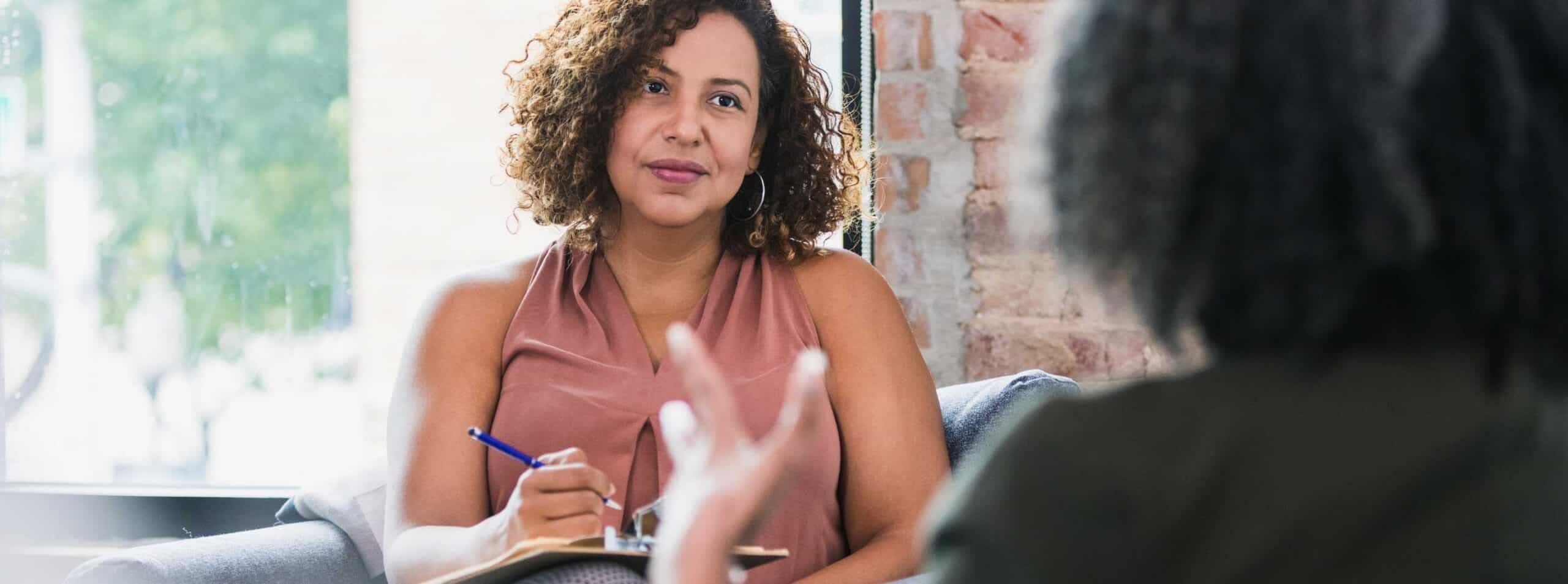 Therapist listening to a client during panic disorder treatment in Massachusetts.