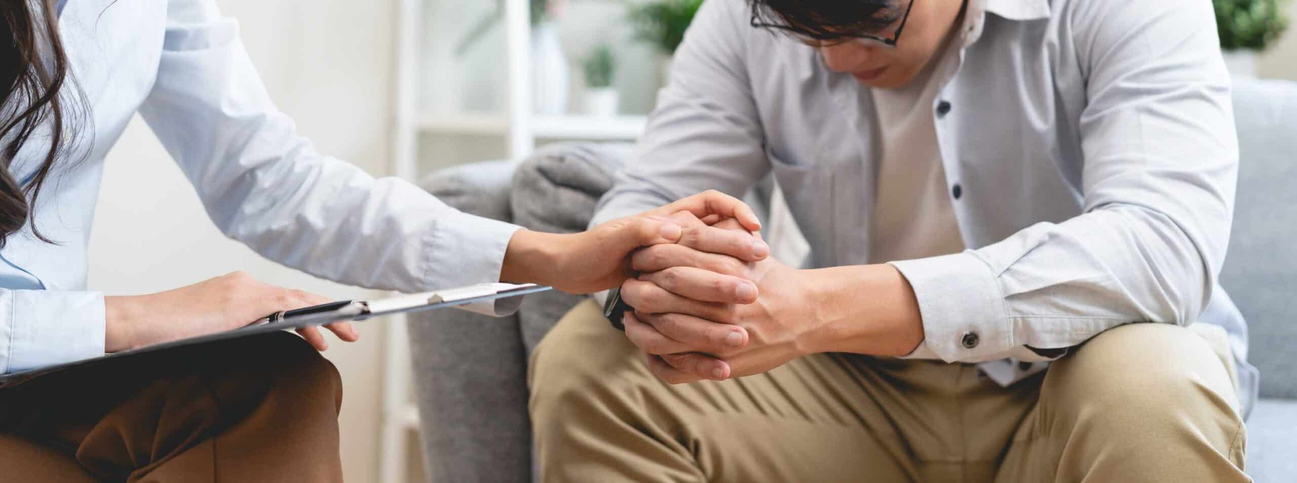 Therapist offering reassurance during bipolar disorder treatment in Massachusetts.