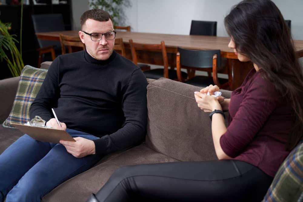 oman speaking with her therapist during a CPTSD treatment session in Massachusetts at Brook Behavioral Health.