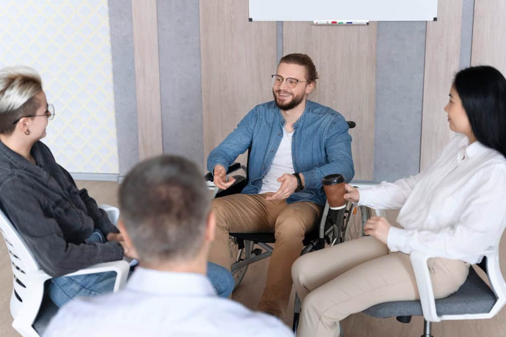 Team members connecting in a supportive environment during trauma therapy in Massachusetts at Brook Behavioral Health.