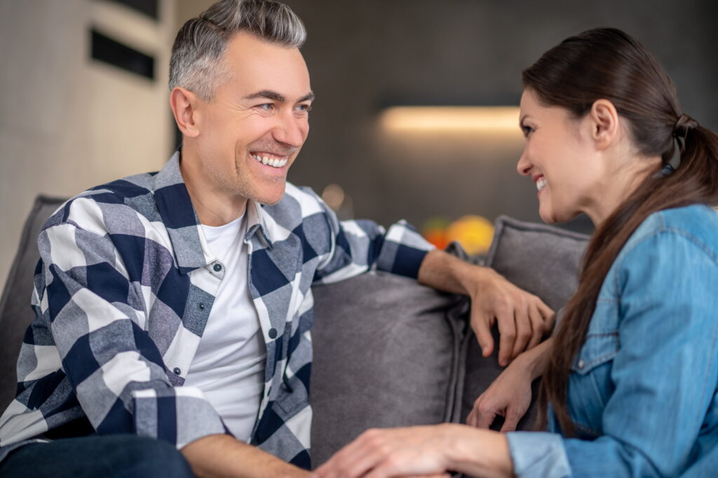 A couple discuss treatment options after researching how to encourage someone to go to therapy.