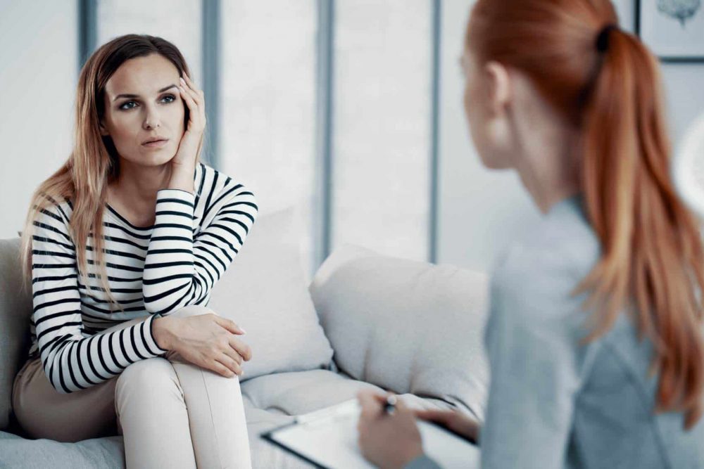 Therapist meeting one-on-one with a client for acute stress disorder treatment in Massachusetts.